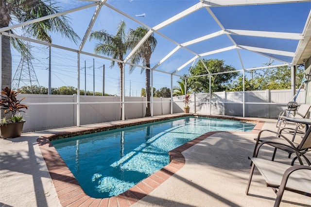 view of pool with a lanai and a patio