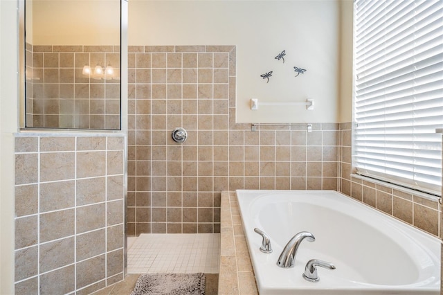 bathroom with separate shower and tub