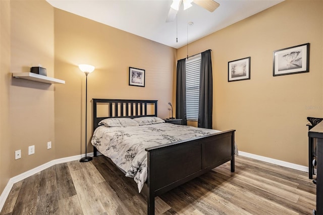 bedroom featuring wood-type flooring and ceiling fan