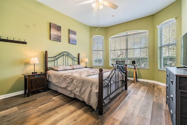 bedroom featuring hardwood / wood-style floors and ceiling fan