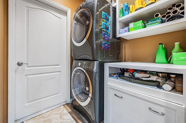 washroom with stacked washer and dryer