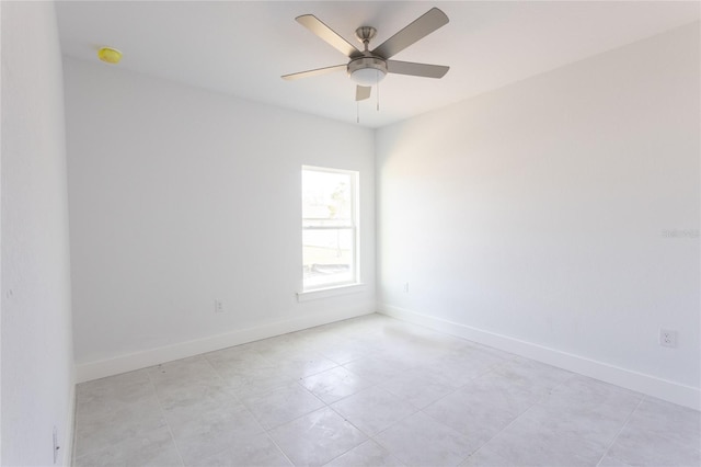 tiled empty room with ceiling fan