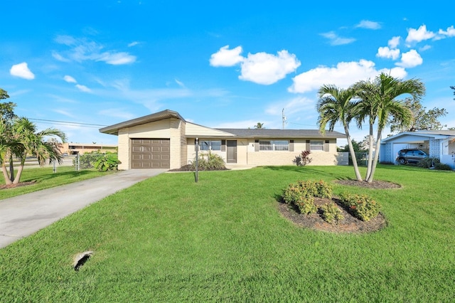 ranch-style house featuring a front yard and a garage