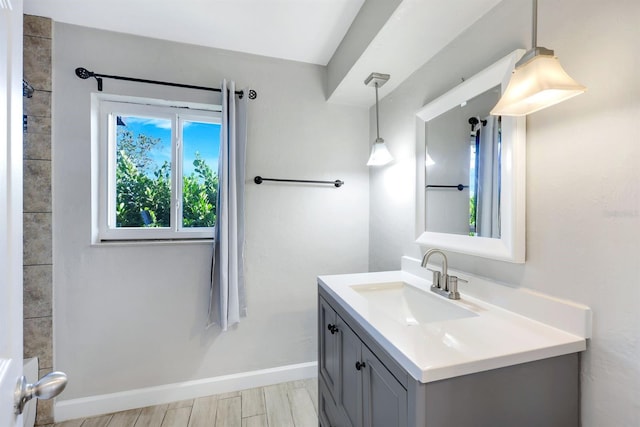 bathroom with vanity and hardwood / wood-style flooring