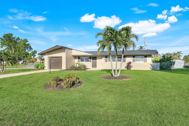 ranch-style house with a garage and a front lawn