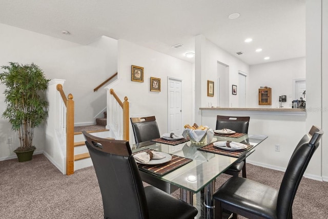 dining area with light carpet