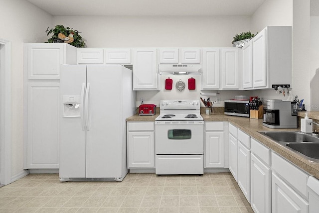 kitchen with white cabinets, white appliances, and sink