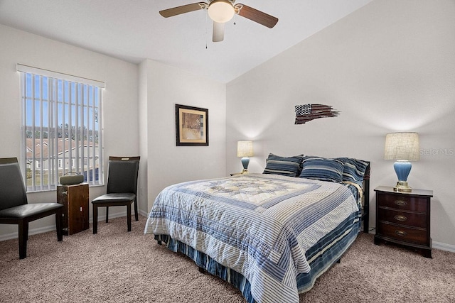 carpeted bedroom with ceiling fan and vaulted ceiling