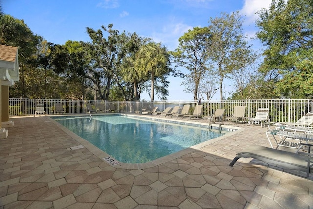 view of swimming pool featuring a patio area