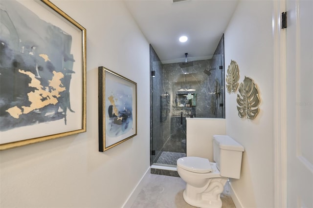 bathroom featuring walk in shower and toilet