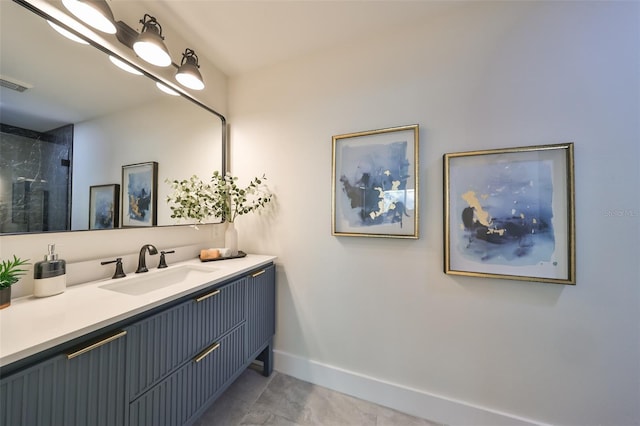 bathroom with tile patterned floors and vanity