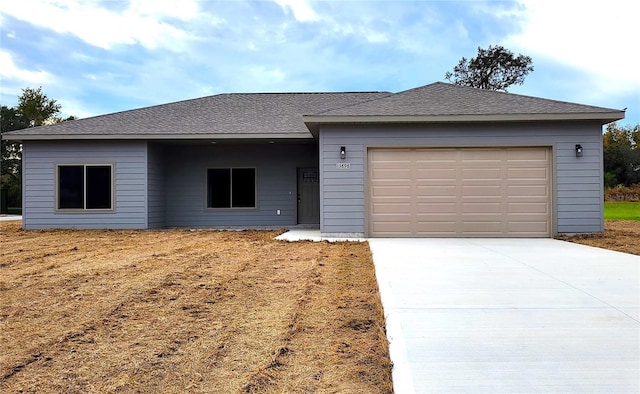 ranch-style home featuring a garage