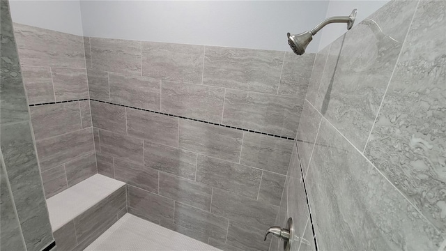 bathroom with tiled shower