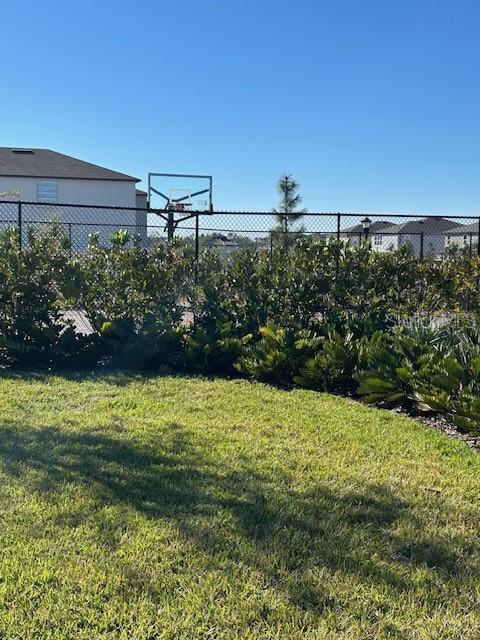 view of yard featuring basketball court