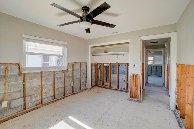 unfurnished room with ceiling fan