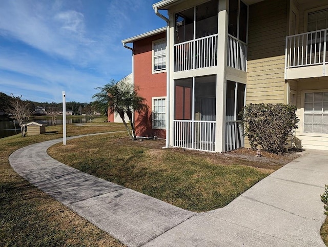 view of home's exterior with a lawn