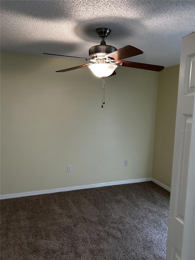 carpeted spare room with a textured ceiling and ceiling fan