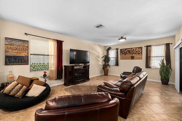 tiled living room with a textured ceiling