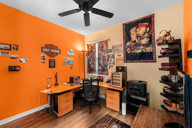 office space featuring ceiling fan, a textured ceiling, and light wood-type flooring