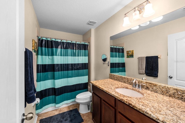 bathroom featuring tile patterned flooring, a textured ceiling, toilet, vanity, and a shower with shower curtain