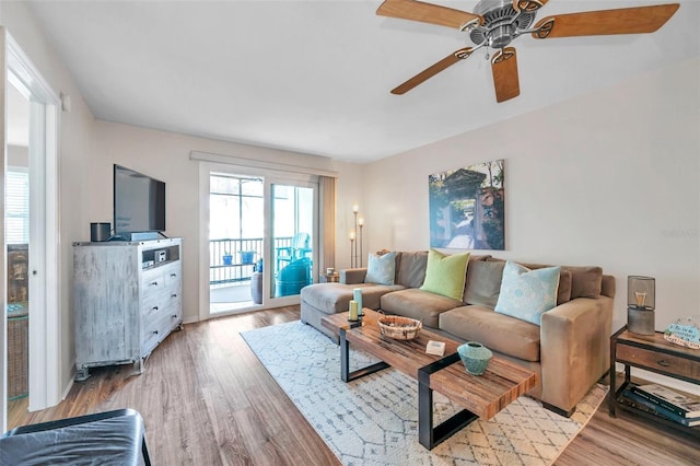 460 Paula Dr S Unit 101, Dunedin, FL 34698 - living area with light wood-style flooring and ceiling fan