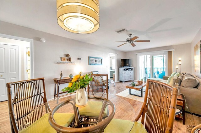 dining space featuring ceiling fan and light hardwood / wood-style flooring