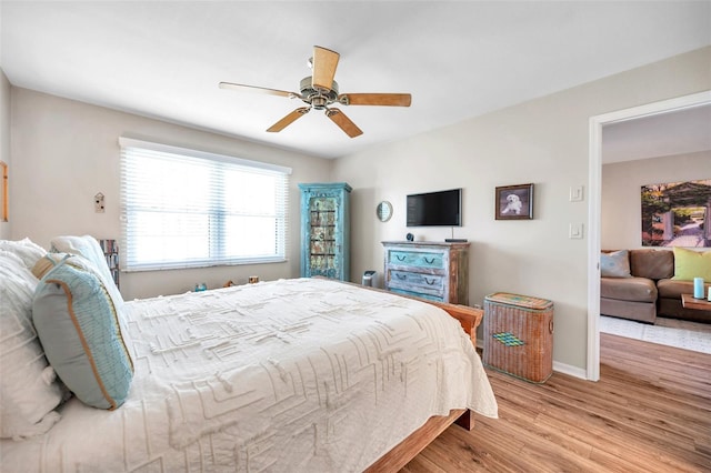 bedroom featuring light wood-type flooring and ceiling fan