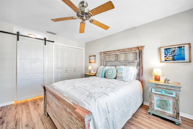 460 Paula Dr S Unit 101, Dunedin, FL 34698 - bedroom with wood finished floors, a closet, and baseboards