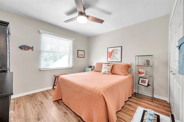 bedroom featuring light hardwood / wood-style floors and ceiling fan