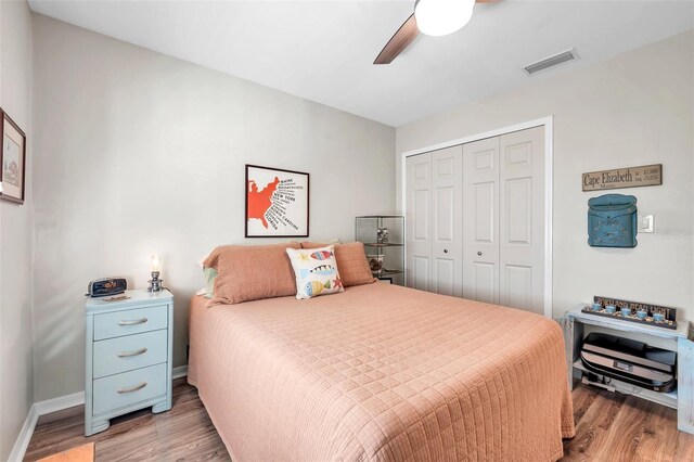 bedroom featuring ceiling fan, a closet, and light hardwood / wood-style floors