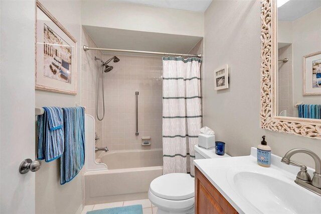 460 Paula Dr S Unit 101, Dunedin, FL 34698 - full bath featuring vanity, shower / tub combo, toilet, and tile patterned floors