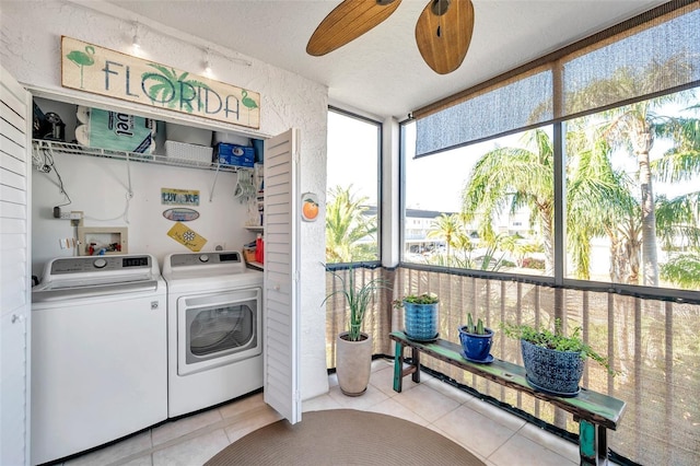 laundry room featuring ceiling fan, separate washer and dryer, a textured ceiling, and light tile patterned floors