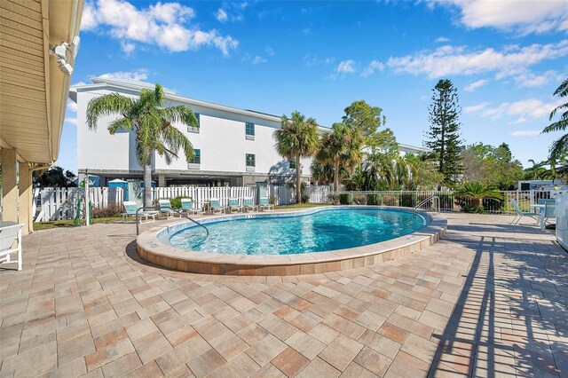 view of swimming pool with a patio