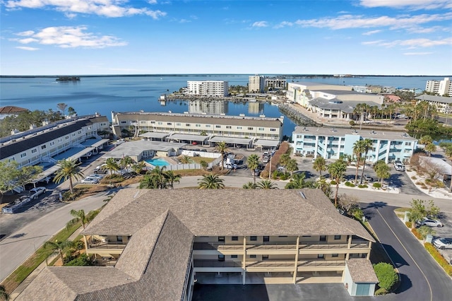 birds eye view of property with a water view