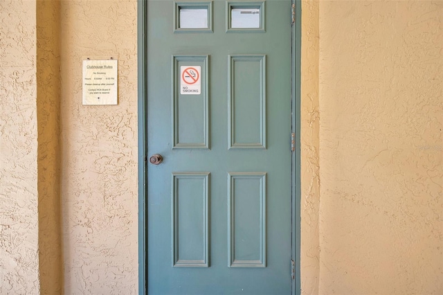 460 Paula Dr S Unit 101, Dunedin, FL 34698 - view of exterior entry featuring stucco siding