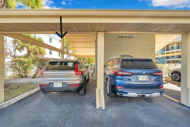 view of parking with a carport