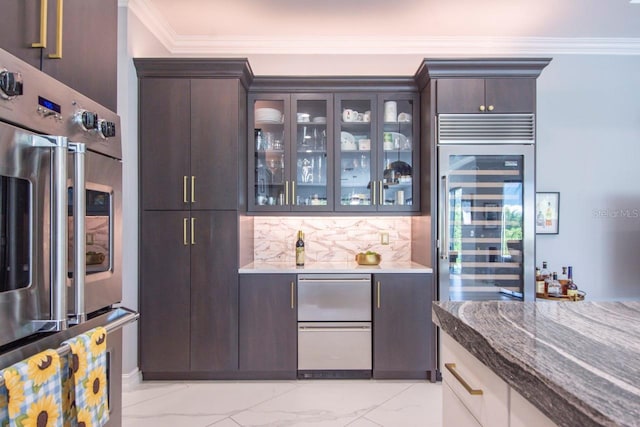 bar with tasteful backsplash, dark brown cabinetry, beverage cooler, and ornamental molding