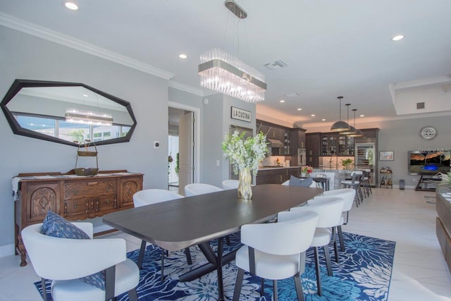 dining space with crown molding and a notable chandelier