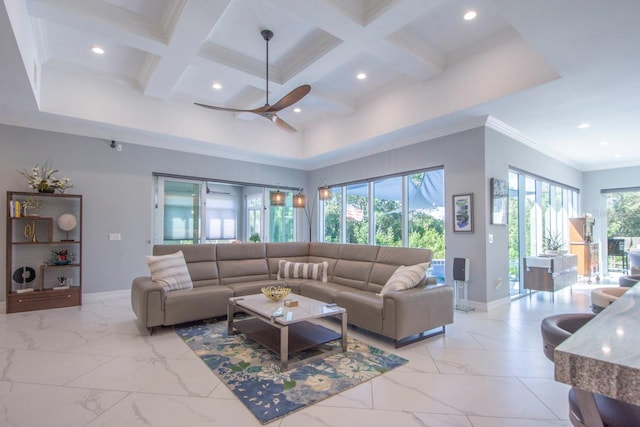 living room featuring ornamental molding, coffered ceiling, ceiling fan, beamed ceiling, and a high ceiling