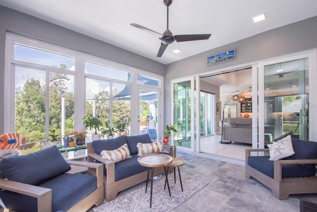 sunroom with plenty of natural light and ceiling fan