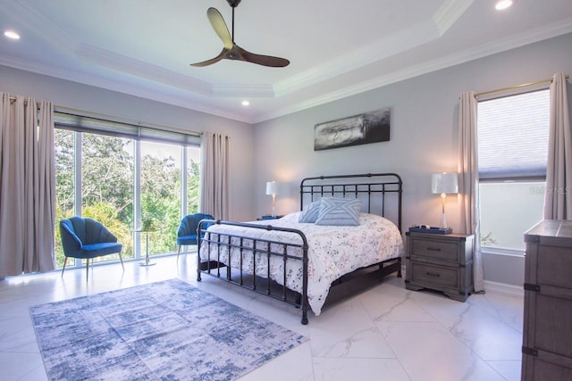 bedroom with a tray ceiling, ceiling fan, and crown molding