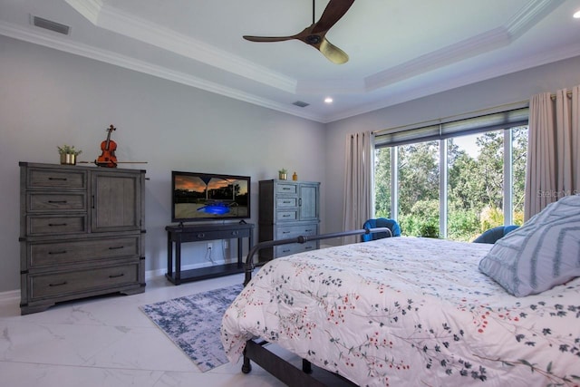 bedroom featuring a raised ceiling, ceiling fan, and ornamental molding