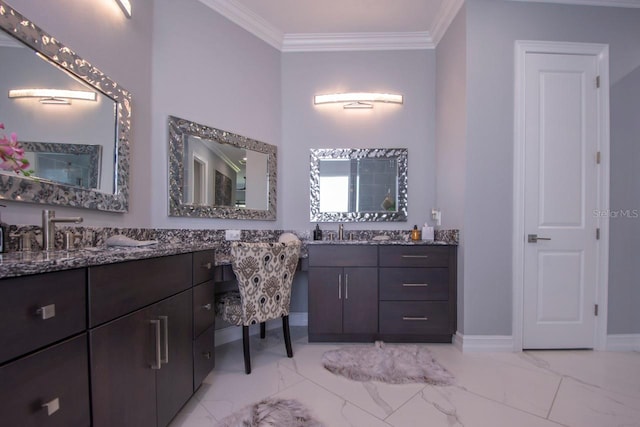 bathroom with crown molding and vanity