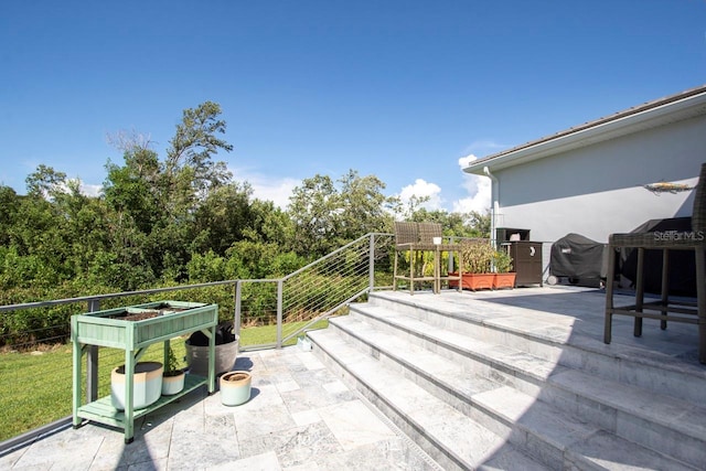 view of patio with a grill