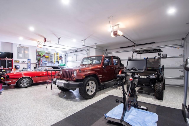 5951 Bay Dr, Gulfport, FL 33707 - garage featuring a garage door opener and electric panel