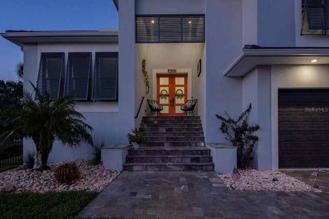 5951 Bay Dr, Gulfport, FL 33707 - property entrance featuring french doors and stucco siding
