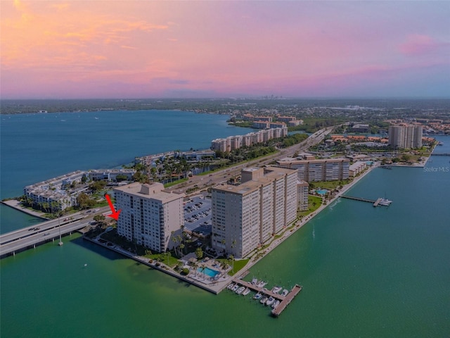 aerial view at dusk with a water view