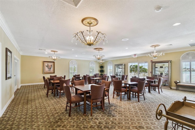 carpeted dining room with a textured ceiling, crown molding, and a wealth of natural light