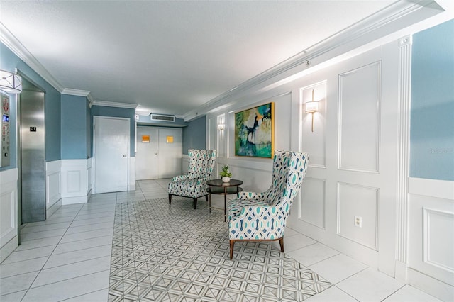 sitting room with elevator, ornamental molding, and light tile patterned flooring