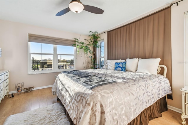 bedroom featuring ceiling fan and light hardwood / wood-style flooring